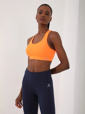 Tommy Life Sporttop in Oranje: voorkant