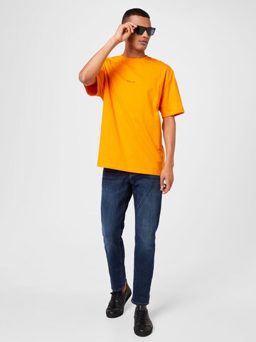 NU-IN - Camisa 'Judgement' em laranja