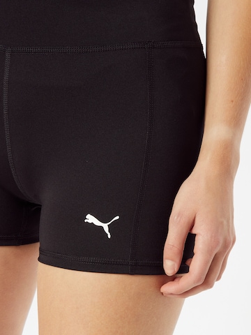 PUMA Regular Sportshorts 'Train Favorite' in Schwarz