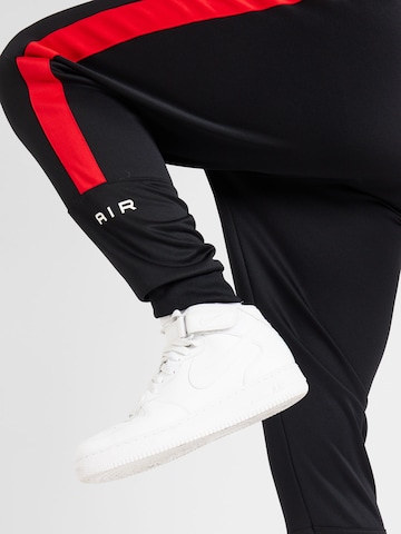 Nike Sportswear Szabványos Funkcionális nadrág 'AIR' - fekete
