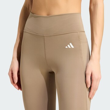 Skinny Pantaloni sportivi 'Opt Ess' di ADIDAS PERFORMANCE in beige