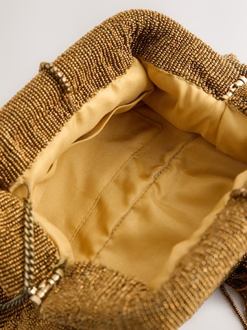 Pochette di Next in oro