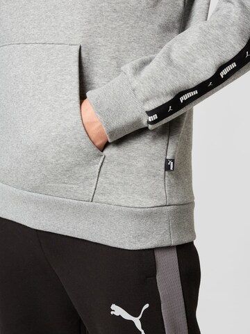 PUMA Sportsweatshirt 'ESS+' in Grau