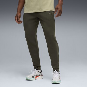 PUMA Regular Sports trousers in Green: front