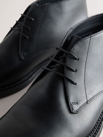 Next - Botines chukka en negro