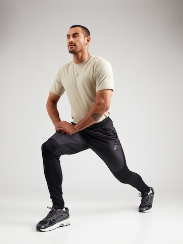juoda ASICS Standartinis Sportinės kelnės 'ROAD'