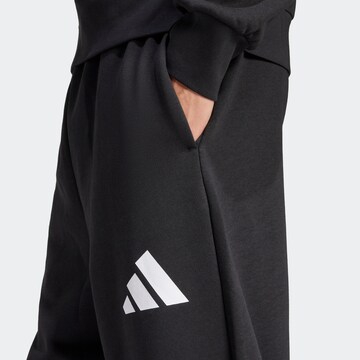 ADIDAS SPORTSWEAR Loosefit Παντελόνι φόρμας σε μαύρο