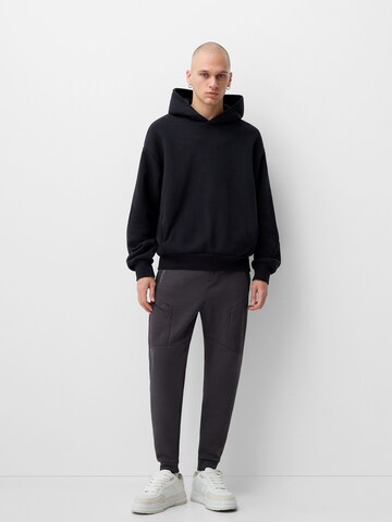 Bershka Tapered Bukser i grå
