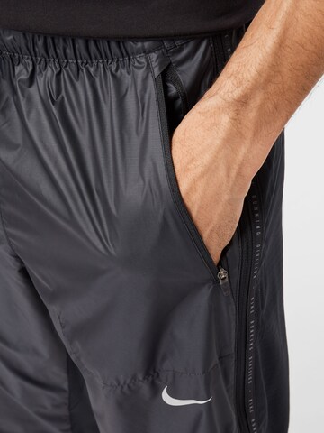 NIKE Regular Workout Pants 'Phenom' in Black