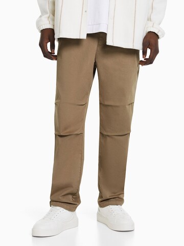 Bershka Regular Trousers in Brown: front