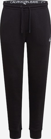 melns Calvin Klein Jeans Pakapēniski sašaurināts piegriezums Bikses: no priekšpuses