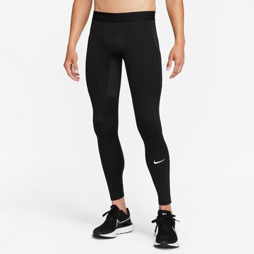 NIKE Skinny Workout Pants 'Pro' in Black: front