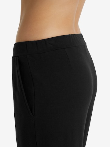 Wide Leg Pantalon de sport 'Dalston' ICEBREAKER en noir