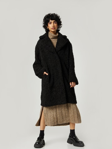 florence by mills exclusive for ABOUT YOU Between-Seasons Coat 'Sunny' in Black: front