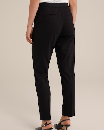 Slimfit Pantaloni con piega frontale di WE Fashion in nero