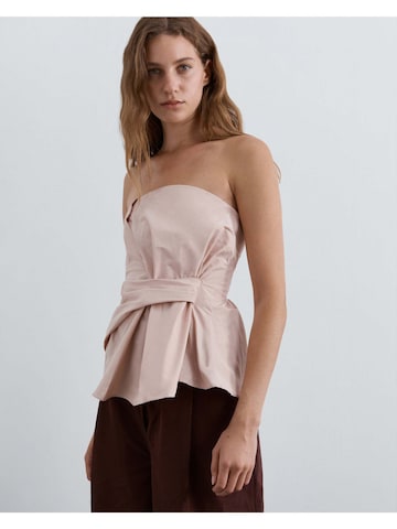 Top di Scalpers in rosa: frontale