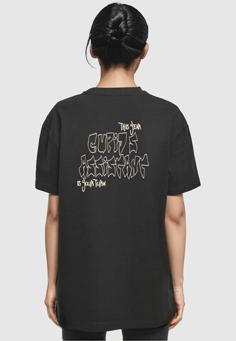Merchcode T-Shirt 'Cupid´s Assistant' in Schwarz: Vorderseite