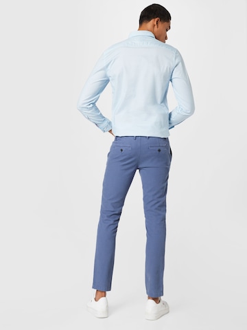 TOMMY HILFIGER - Slimfit Calças chino 'BLEECKER' em azul