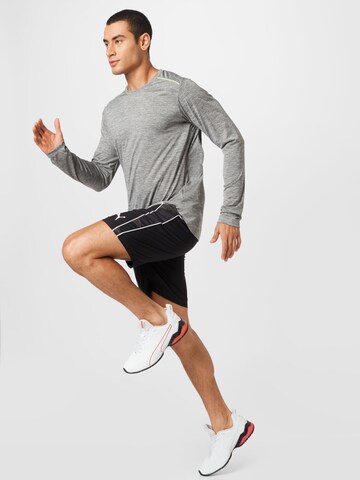 PUMA Sportshirt in Grau
