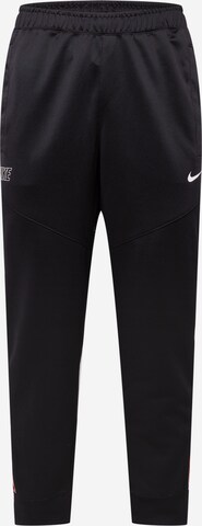 Nike Sportswear Tapered Trousers in Black: front