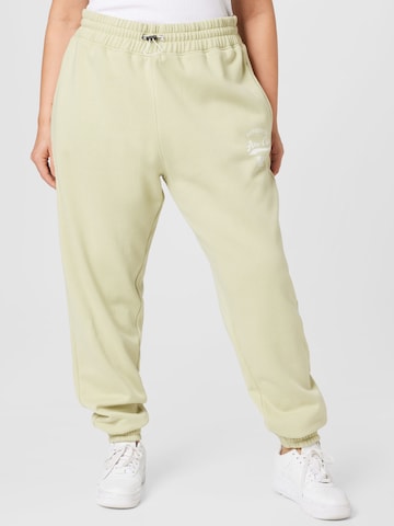 Public Desire Curve Tapered Trousers in Beige: front