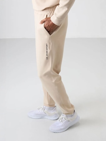 Tuta da jogging di Tommy Life in beige