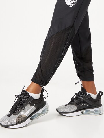 NIKE Regular Workout Pants in Black