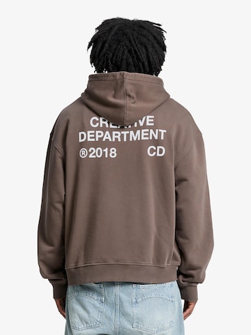 Reternity Sweatshirt 'Creative Dept' in Bruin: voorkant