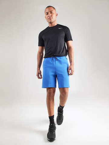 Nike Sportswear Loosefit Byxa 'TECH FLC' i blå