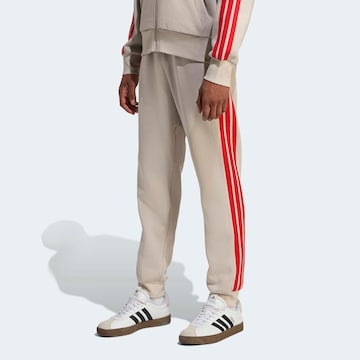 ADIDAS SPORTSWEAR Tapered Workout Pants in White: front