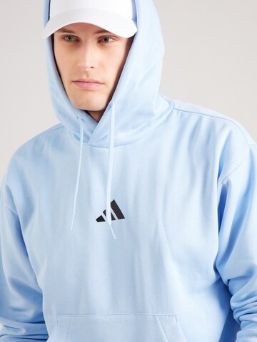 ADIDAS SPORTSWEAR Sports sweatshirt 'FEELCOZY' in Blue