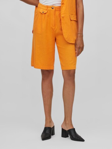 VILA Normalny krój Spodnie w kolorze pomarańczowy: przód
