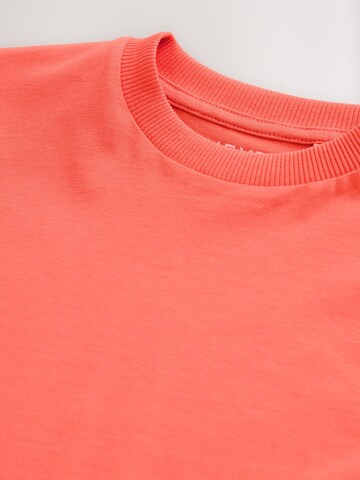 T-Shirt Next en orange