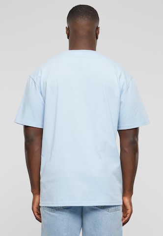 Karl Kani T-Shirt 'KM-TE011-090-26' in Blau