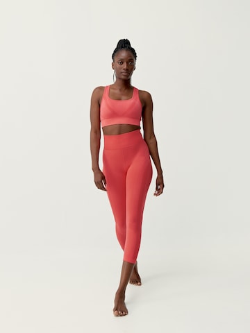 Skinny Pantalon de sport 'Nish' Born Living Yoga en orange