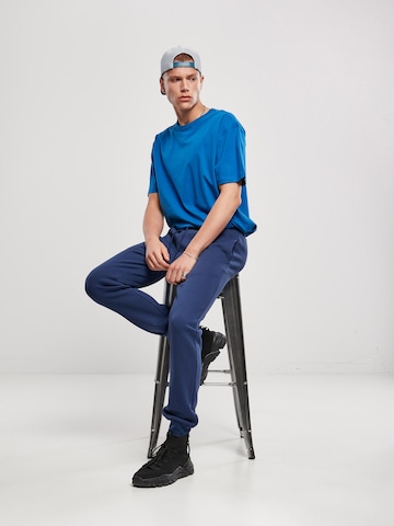 Urban Classics Zúžený Kalhoty 'Basic' – modrá