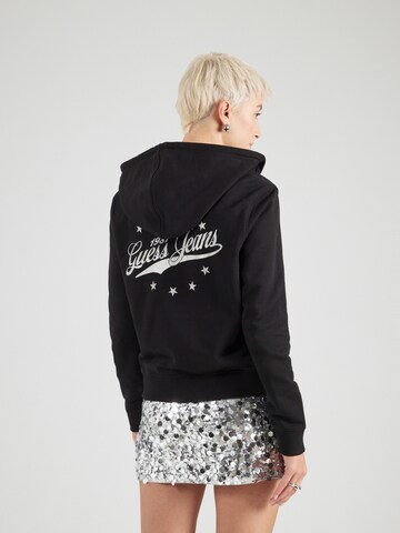 Veste de survêtement GUESS JEANS en noir : devant