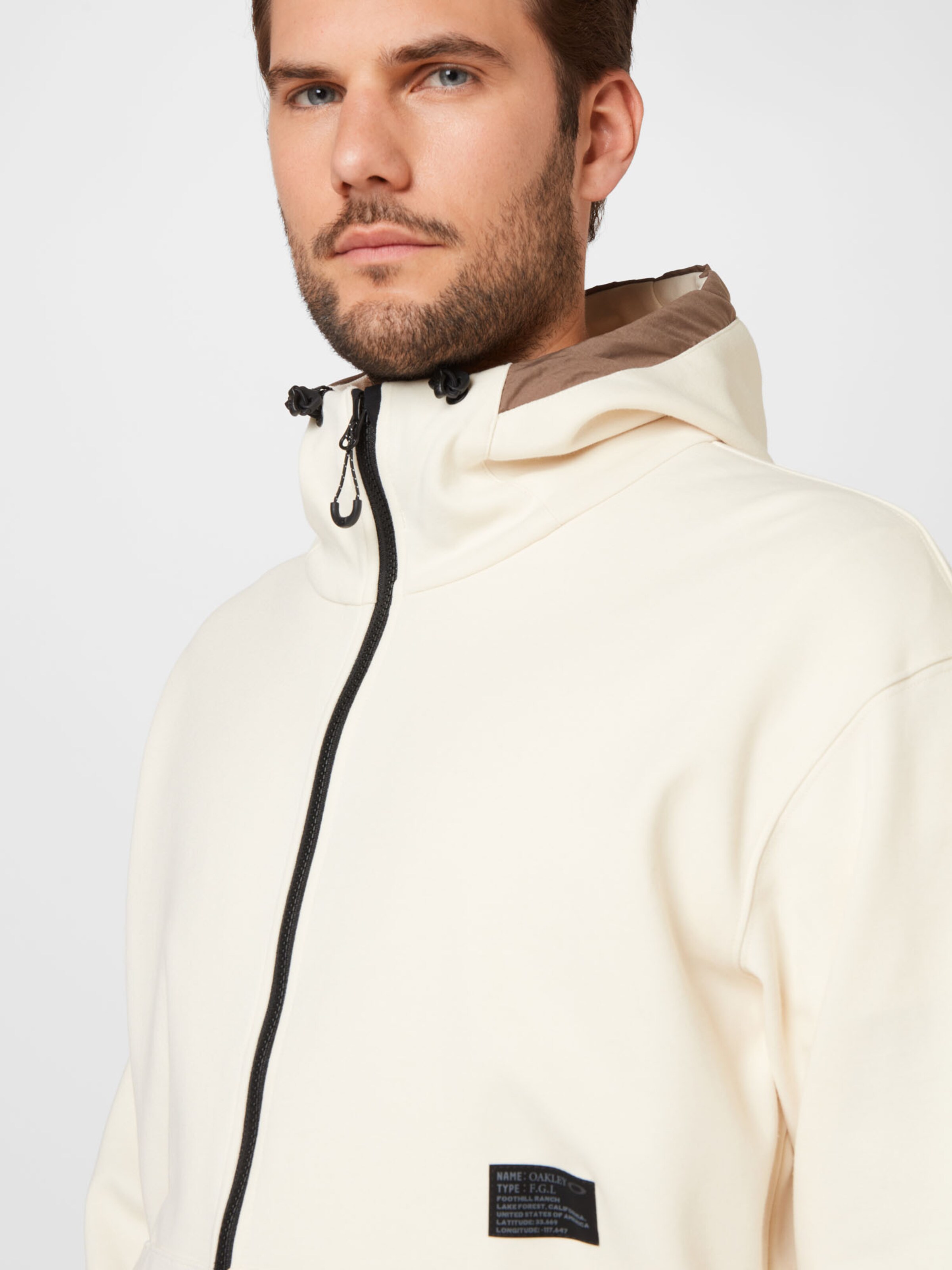 Männer Sportbekleidung OAKLEY Sportsweatjacke in Hellbeige - XV04681 Männer Sportbekleidung OAKLEY Sportsweatjacke in Hellbeige - XV04681