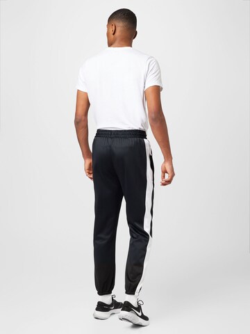 NIKE Tapered Sports trousers 'STARTING 5' in Black