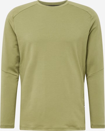 On T-shirt 'Focus' i grön: framsida