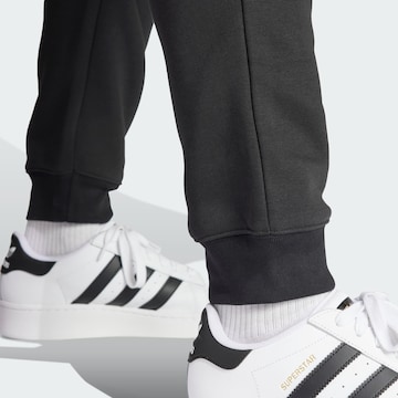 juoda ADIDAS ORIGINALS Siaurėjantis Kelnės 'Trefoil Essentials'