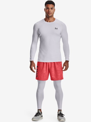 UNDER ARMOUR Regular Urheiluhousut 'Emboss' värissä punainen