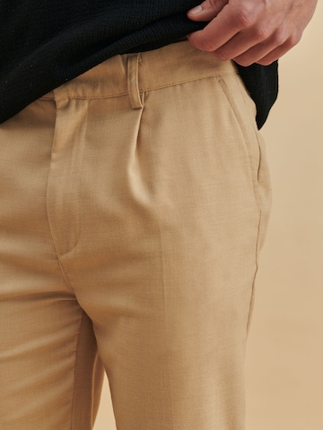 DAN FOX APPAREL Tapered Pleated Pants 'Ediz' in Beige