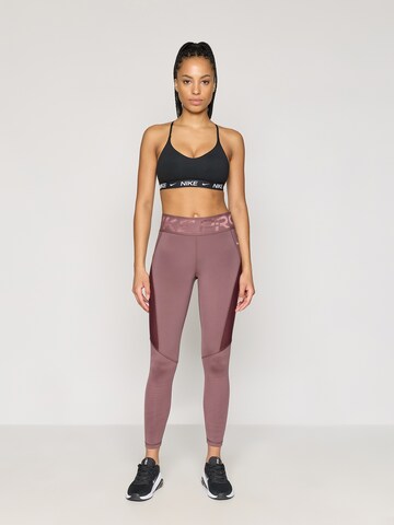NIKE - Skinny Calças de desporto em roxo