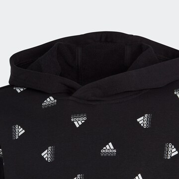 ADIDAS SPORTSWEAR Sportsweatshirt 'Brand Love Allover Print' in Schwarz