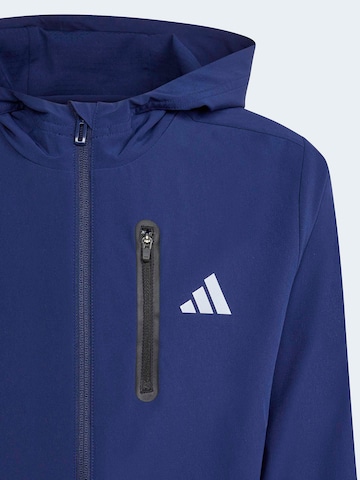 ADIDAS SPORTSWEAR Спортна жилетка с качулка в синьо