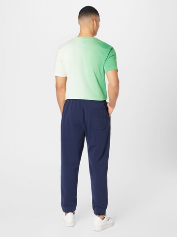 Tommy Jeans Tapered Broek in Blauw