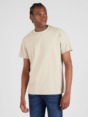 Calvin Klein Jeans T-shirt i beige: framsida