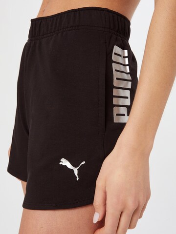 Regular Pantaloni sport de la PUMA pe negru