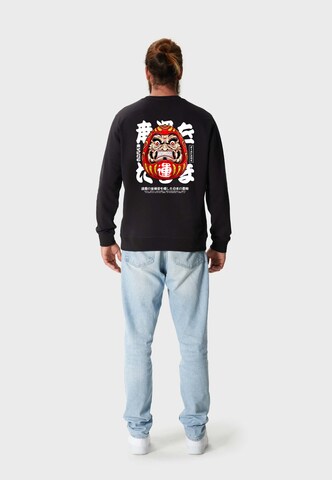 Oldskull Sweatshirt 'ASIAN FURIOUS DARUMA' in Schwarz